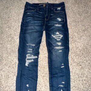 Distressed blue jeans